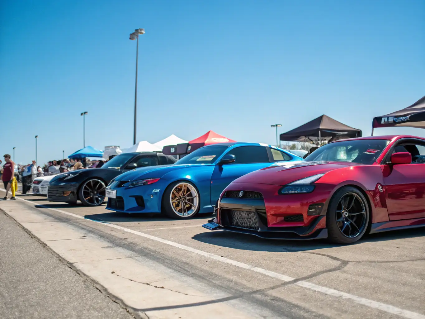 A photograph of a sponsored automotive event with Sandstorm Import's logo prominently displayed, showcasing their involvement in the industry and networking opportunities.