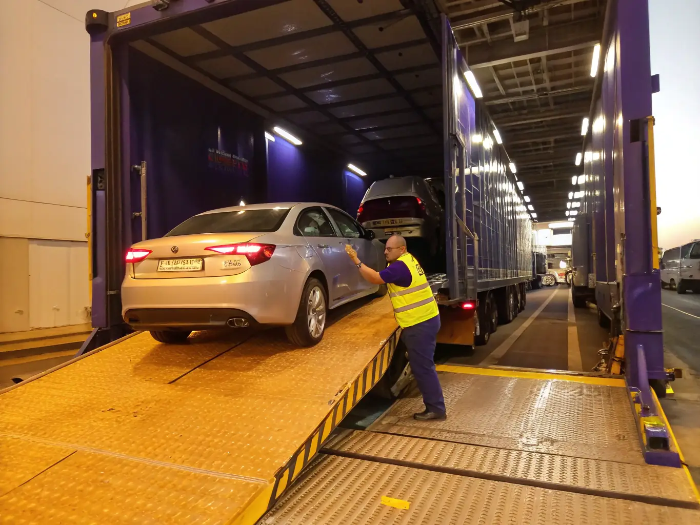 A high-quality print advertisement featuring a classic car being transported, highlighting Sandstorm Import's expertise in vehicle logistics and advertising.